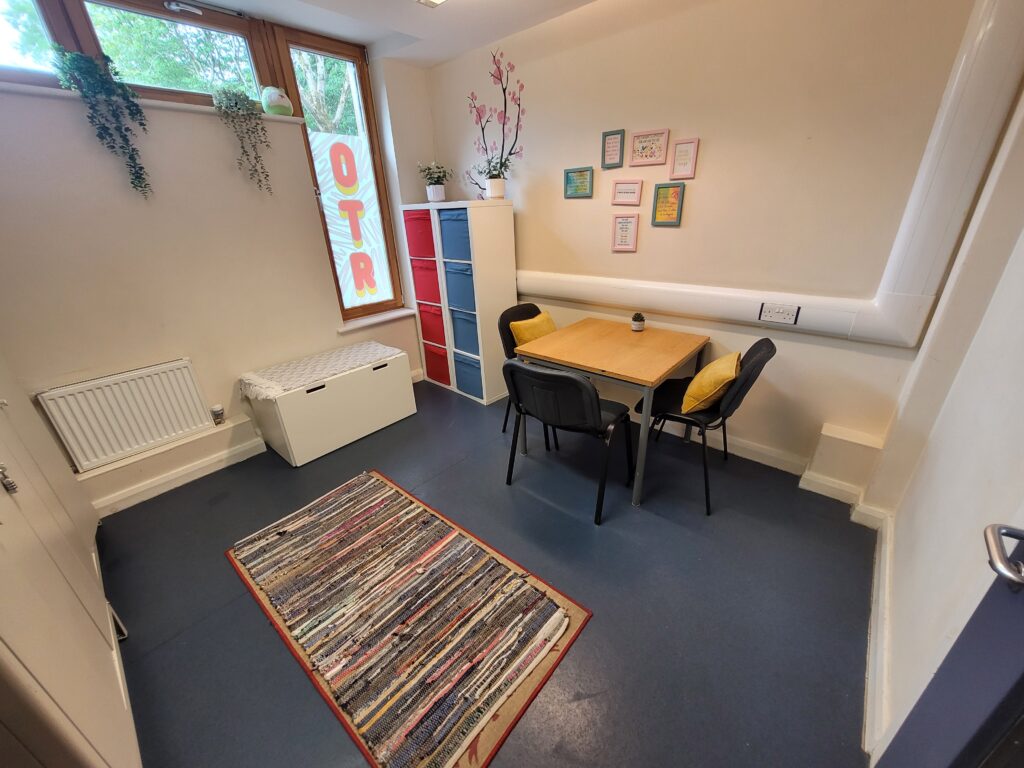Small room with a table and 3 chairs