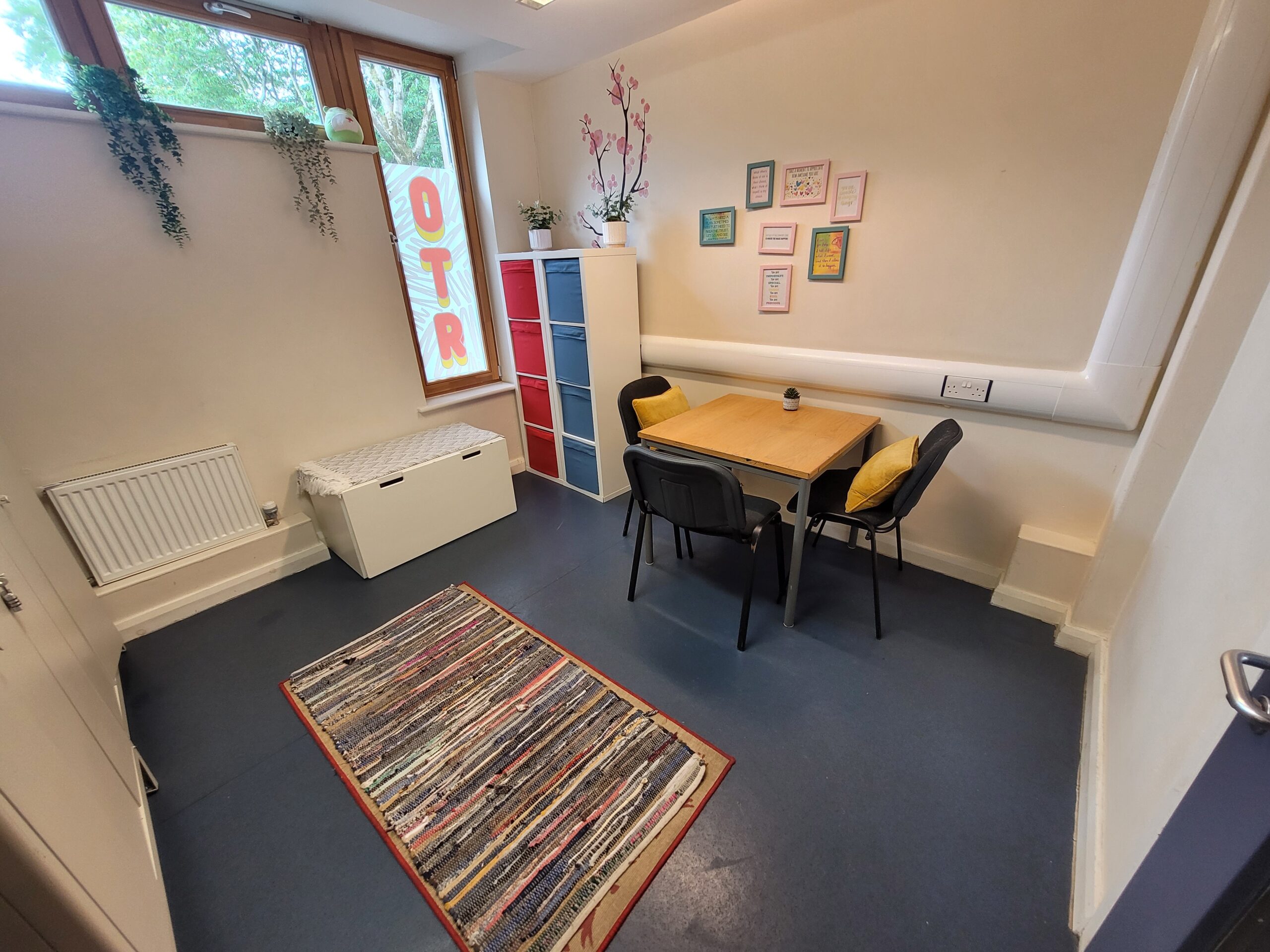 Small room with a table and 3 chairs